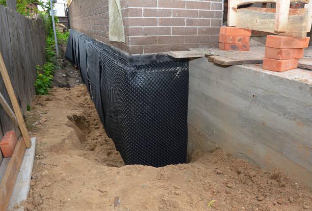 SJ Waterproofing Pros technician performing targeted Waterproofing assessment in Wilmington, NC